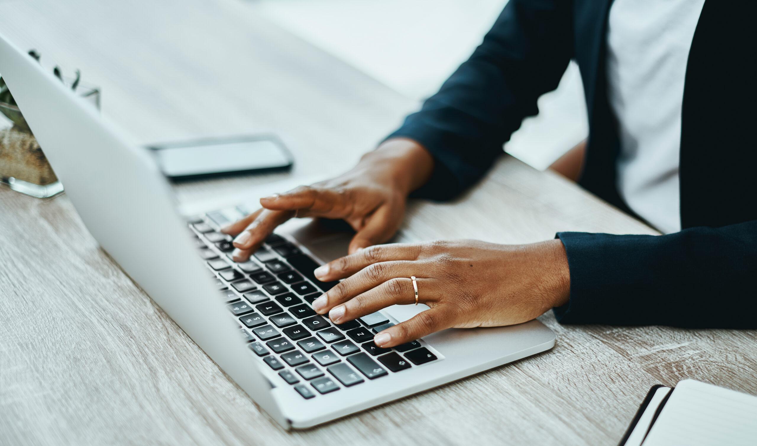 Shot of a businesswoman using a laptop in a modern office